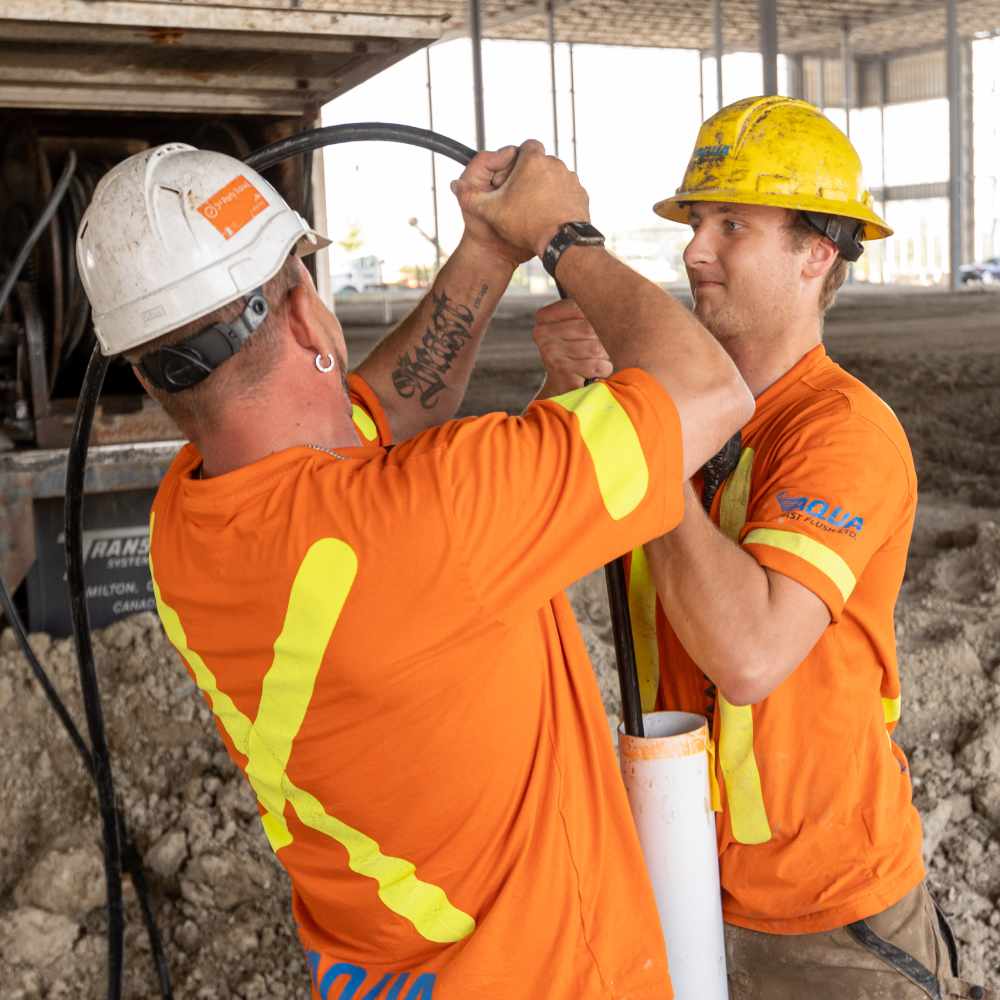 Commercial Construction Drain Care team doing a pipe flushing service