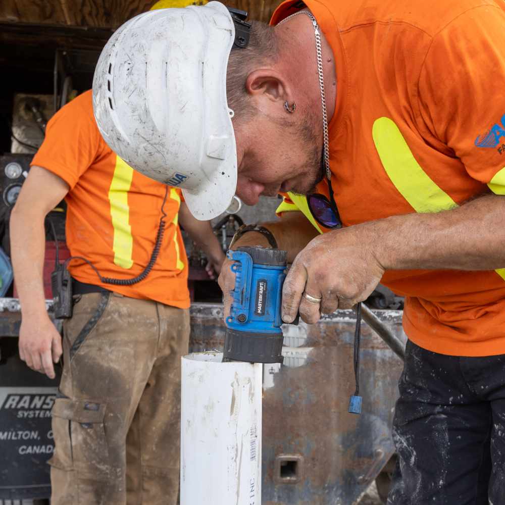 Commercial Construction Drain Care team doing an assessment of pipe after service.