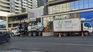 Aqua Flush high-pressure flushing truck on a job site.