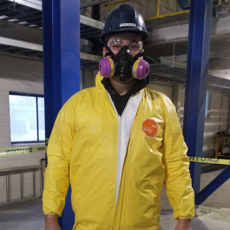 Aqua Fast Flushing Employee committing a Tank Cleaning Inspection in a food processing factory.