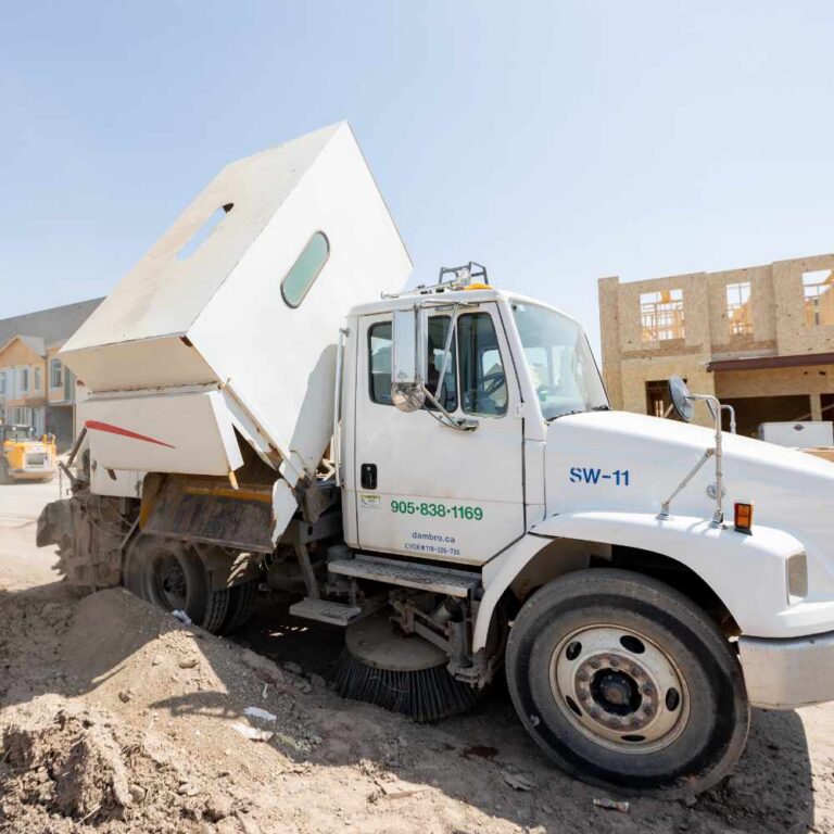A Street Sweeping Vehicle Showing the Dirt Collected During A Street Sweeping