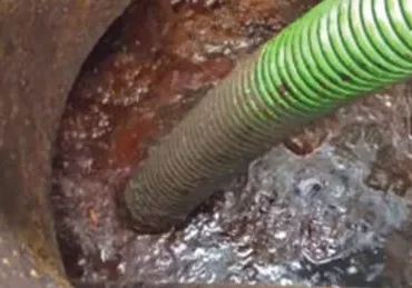 Cleaning an industrial grease trap